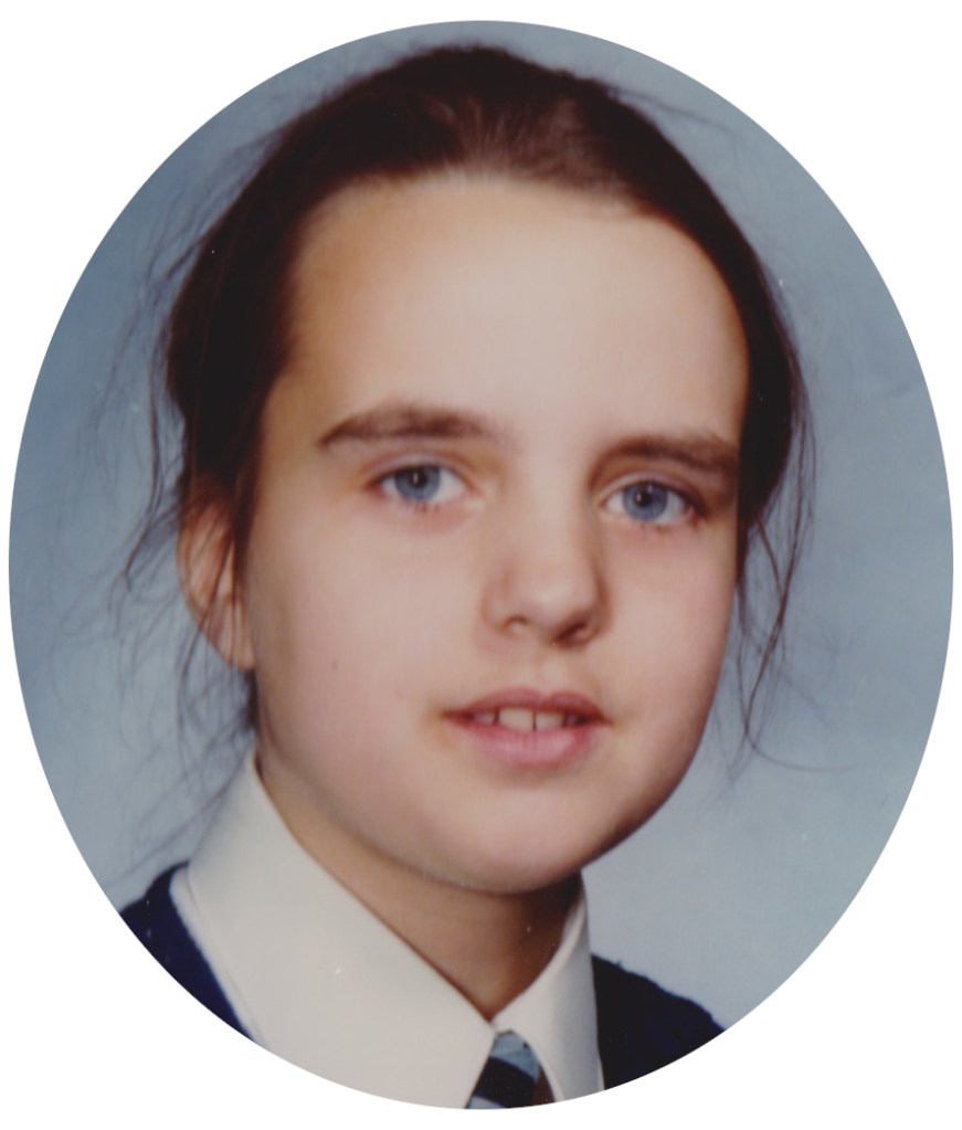 A school photo showing Harriet, aged about ten, in uniform, hair tied back but wisps escaping. The eyes look bluer than they do now.